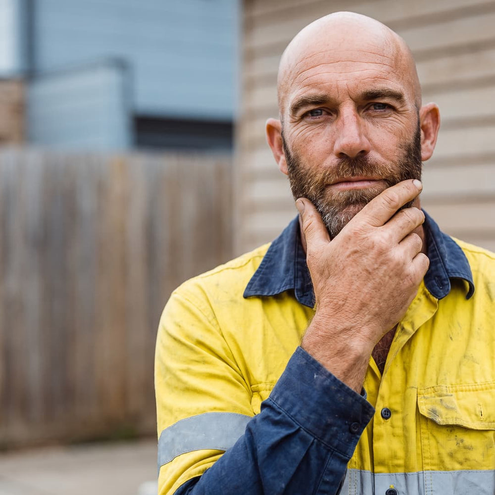 Australian tradie with beard wearing hi-vis — Skin Tank natural men's moisturiser to maintain skin